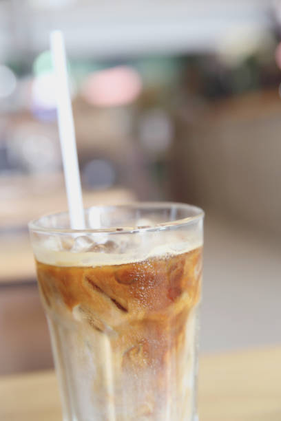 istock Iced coffee on wood background 878209894