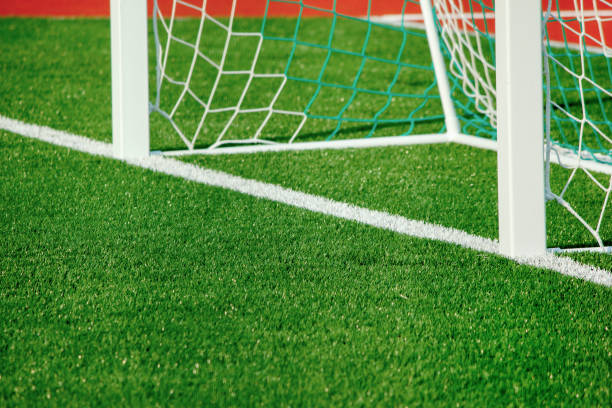istock Football field with artificial cover. 878210108