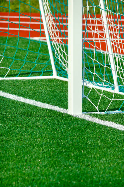 istock Football field with artificial cover. 878210182