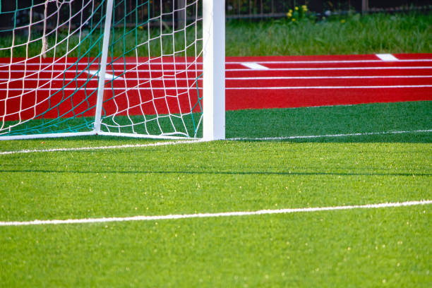istock Football field with artificial cover. 878210224