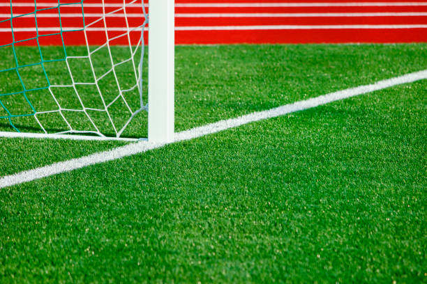 istock Football field with artificial cover. 878210458