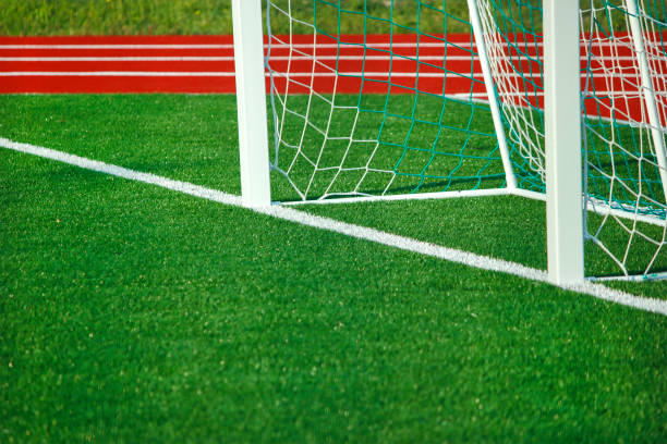 istock Football field with artificial cover. 878210524