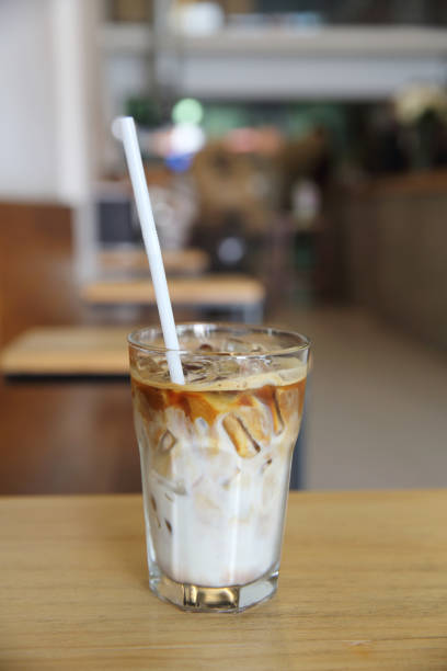 istock Iced coffee on wood background 878211058