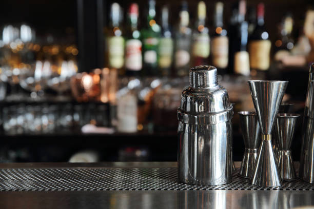 istock cocktail shaker on counter bar background 878215344