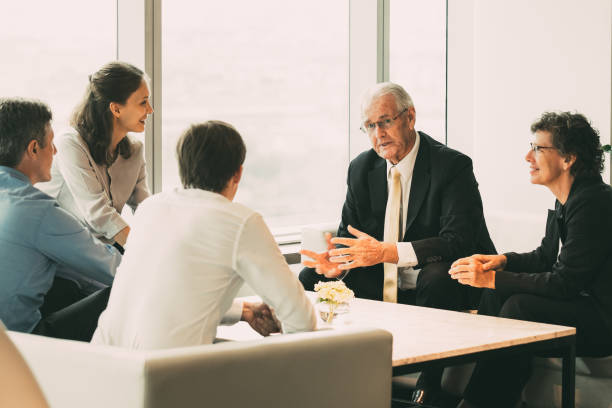 istock Business Leader Explaining Idea to Colleagues 878220280