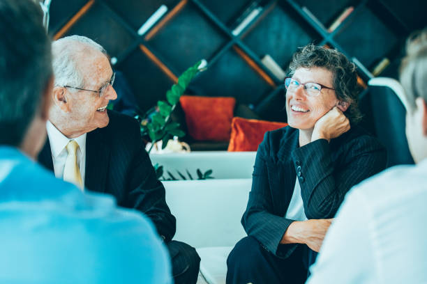 istock Business Partners Having Rest and Talking in Lounge 878220446