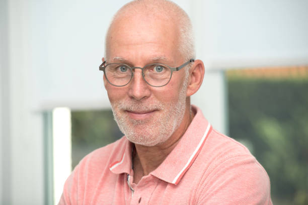 istock an mature senior man with pink shirt 878220710