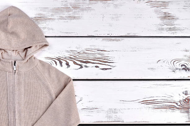 istock Boys hooded warm beige sweater. 878222450
