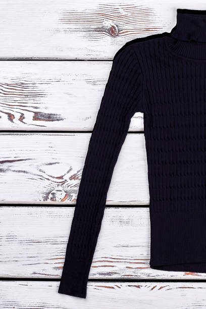 istock Cropped image of black turtleneck sweater. 878223358