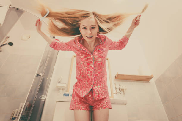 istock Woman with long windblown blonde hair 878230176