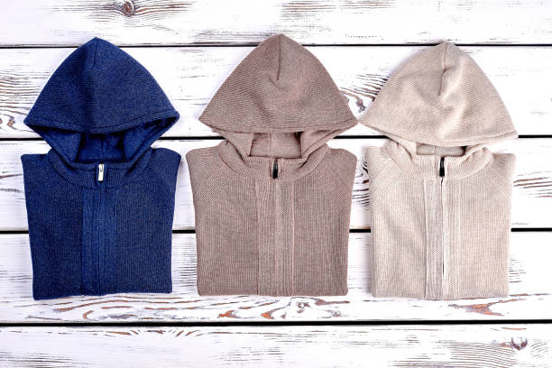 istock New hooded sweaters, top view. 878230942