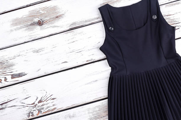 istock Girls black school dress, copy space. 878233466