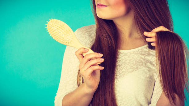 istock Happy woman brushing her hair 878234172