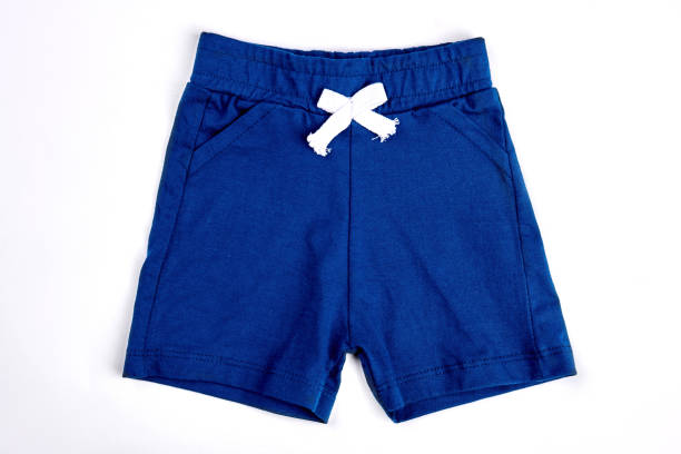 Toddler boy shorts isolated on white. Toddler boy shorts isolated on white. Casual cotton dark blue shorts, top view. Kids textile summer outfit. baby boutique stock pictures, royalty-free photos & images