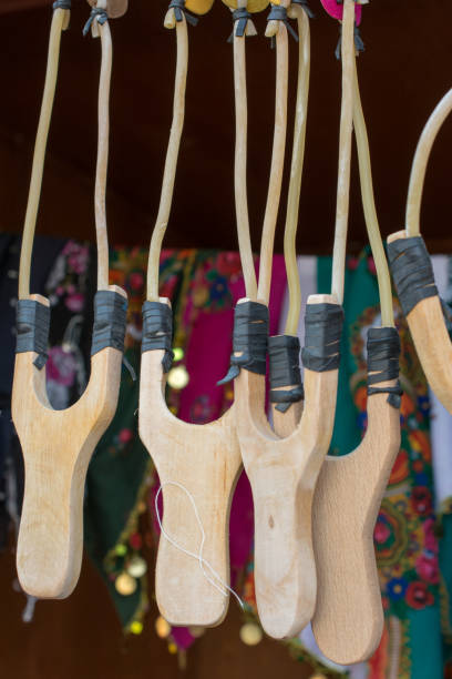 istock Wooden catapult slingshot ready to use 878239400