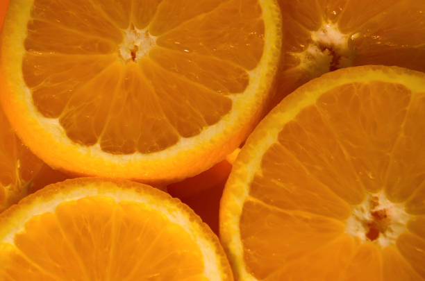istock Round slices of orange closeup 878245522