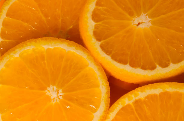 istock Round slices of orange closeup 878245626