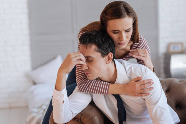 istock Kind loving woman hugging her exhausted depressed husband 878253100