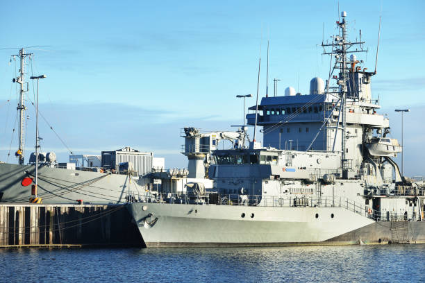 istock Moored military ships on a pier in Kiel 878257556