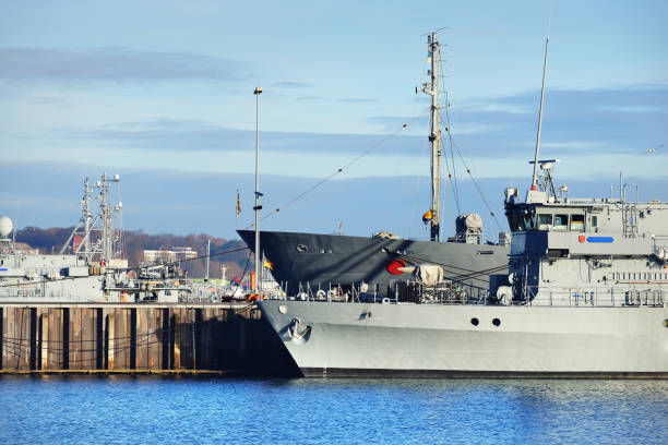 istock Moored military ships on a pier in Kiel 878257574