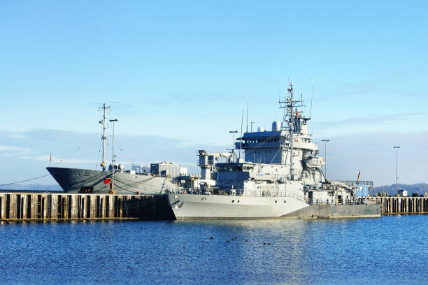istock Moored military ships on a pier in Kiel 878257602