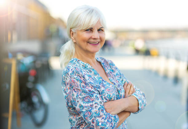 istock Senior woman standing outdoors 878257832