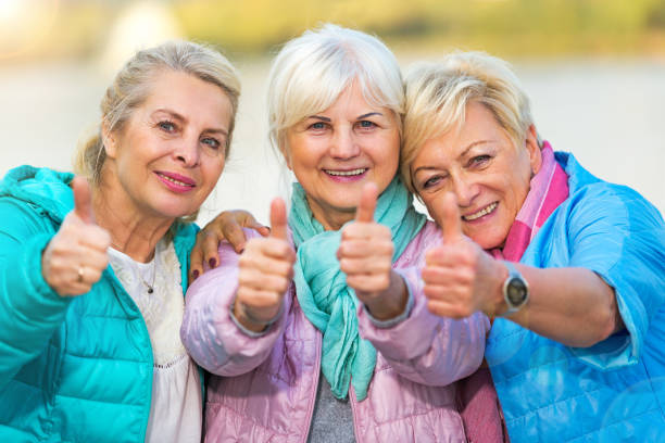 istock Senior women showing thumbs up 878257834