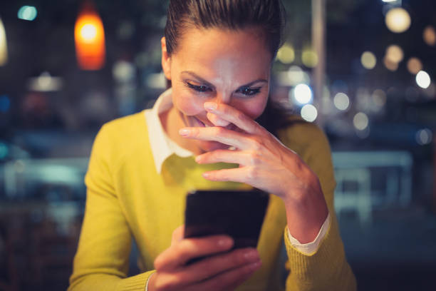 istock Single. Young woman enjoying coffee and using a smart phone in cafe 878265088