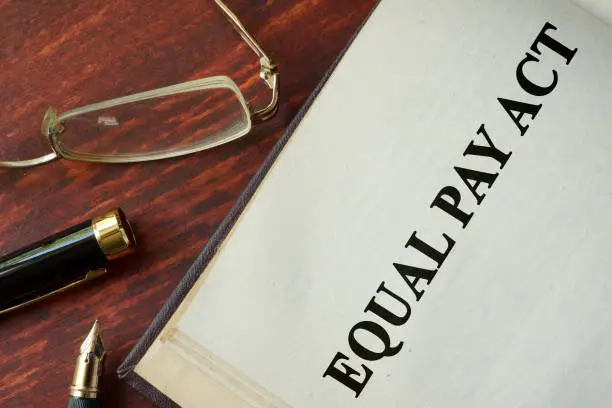Equal Pay Act of 1963 written on a page.