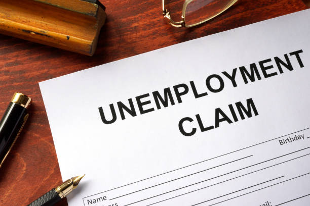 unemployment claim form on an office table. - unemployment imagens e fotografias de stock