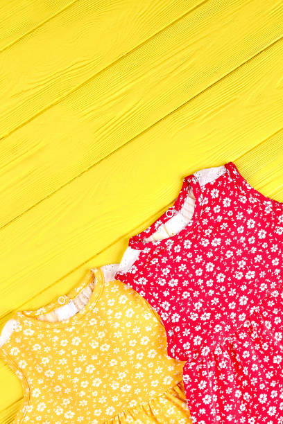 istock Infant girl colored patterned dresses. 878298284