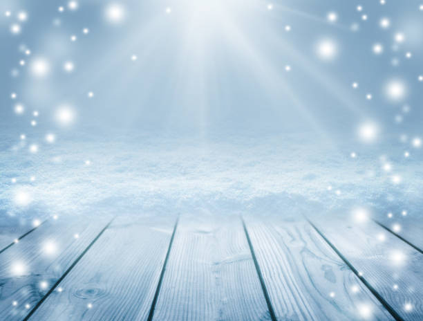 istock . Winter background. Sun rays and snowfall.Snowy Plank With Wintry  Background. 878310306