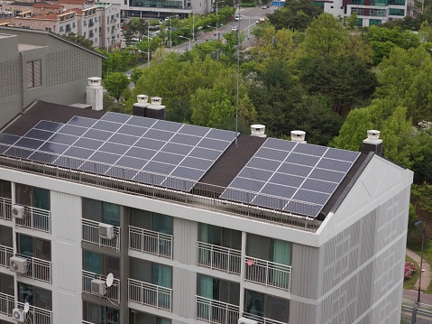 many solar cells on house roofs in rural village in europe