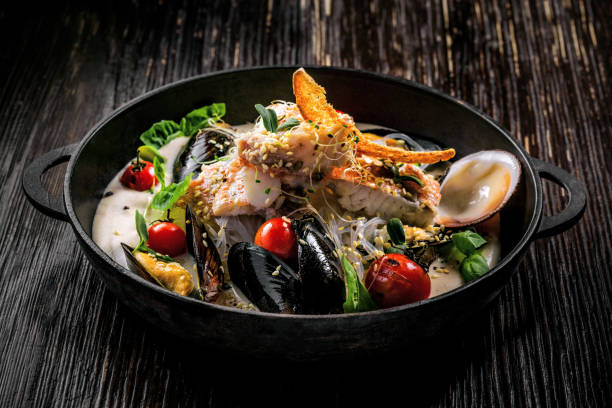 istock Bass fish and seafood with rice noodles 878321746