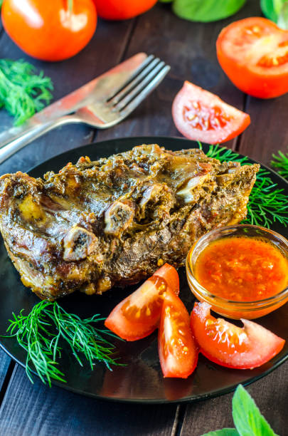 istock Pork meat on ribs baked in an oven 878336786