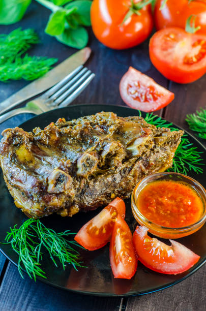 istock Pork meat on ribs baked in an oven 878336868