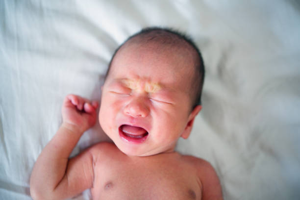 istock New born baby boy crying 878339126