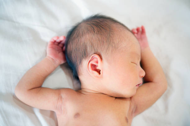 istock Sleeping newborn baby boy. 878340160