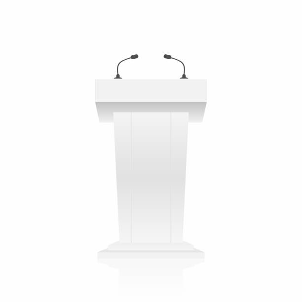 istock Podium, tribune, stand rostrum with microphones. Back view from audiences side 878341470