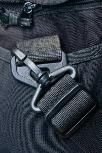 istock black plastic carabiner on an old bag made of cloth 878345698