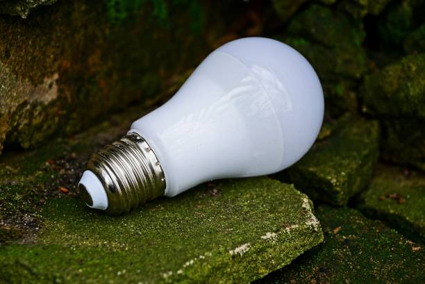 istock white light bulb rests on old stones near the wall 878346424