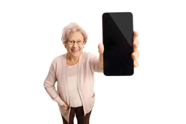 Photo of Senior lady showing a phone and smiling