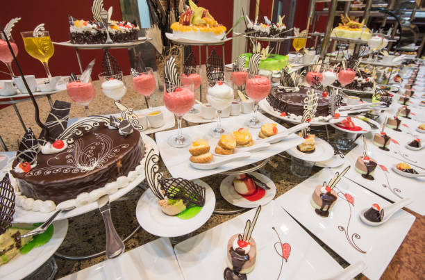 istock Selection of desserts on display at a restaurant buffet 878349886