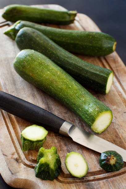 istock Fresh zucchini on wooden board 878362096