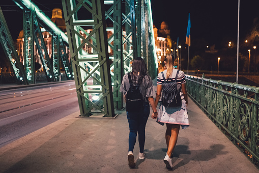 Two girls hanging out in Budapest during night