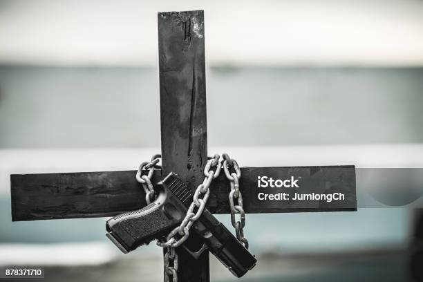 Black Cross With A Looped Chain Stock Photo - Download Image Now - Bible, Gun, Black Color