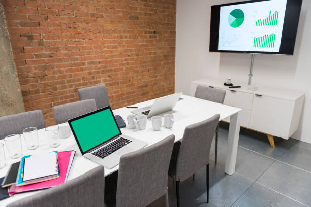 istock Contemporary Office Table with Equipments and Chairs 878372048