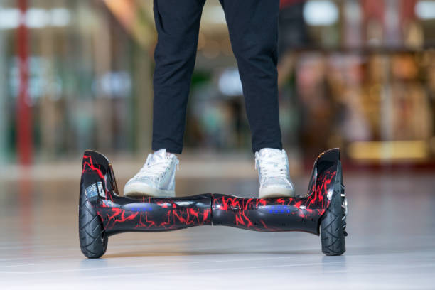 Girl feet on the hover board. Self-balancing scooter or mini segway. Girl feet on the hover board. Self-balancing scooter or mini segway hoverboard stock pictures, royalty-free photos & images