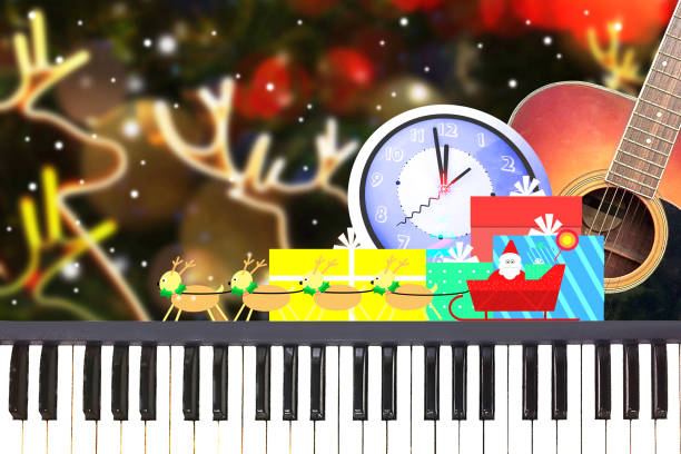 Christmas party music with piano and guitar at midnight time on christmas night blur background. stock photo