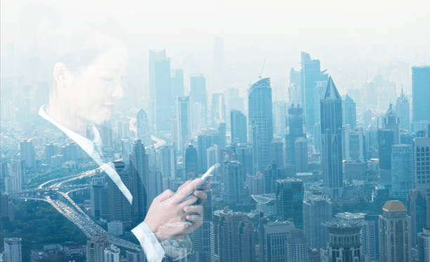 istock Multiple exposure of businesswoman using smart phone 878384246